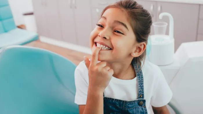 Little girl showing clean teeth